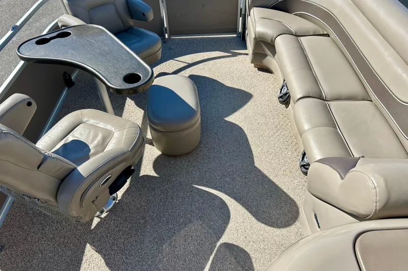 Slide: The Image of 2007 Premier 250 Intrigue boat interior with beige seating and a table. - 55