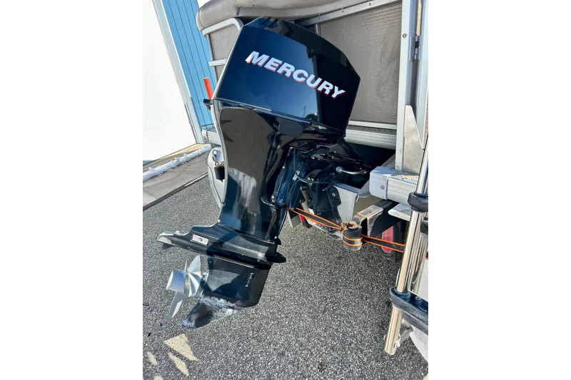 Slide: The Image of Outboard motor on a 2007 Premier 250 Intrigue boat, featuring a Mercury engine. - 8