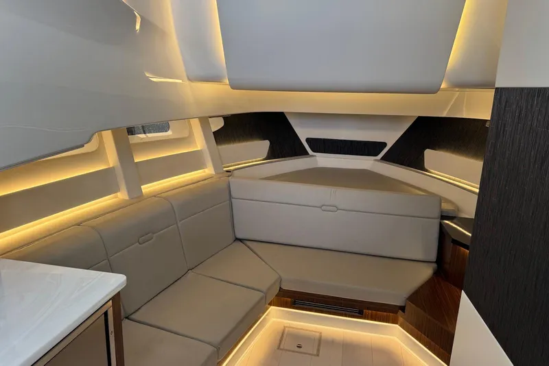 Slide: The Image of Luxurious interior of 2022 Sea Ray Sundancer 370 Outboard with modern seating and ambient lighting. - 21