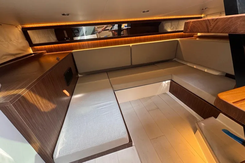 Slide: The Image of Luxurious interior of 2022 Sea Ray Sundancer 370 Outboard with elegant seating and ambient lighting. - 23