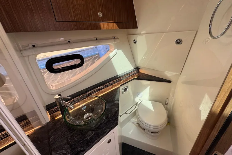Slide: The Image of Luxurious bathroom in 2022 Sea Ray Sundancer 370 Outboard with modern fixtures and elegant design. - 24