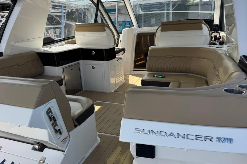 Slide: The Image of 2022 Sea Ray Sundancer 370 Outboard interior with luxurious seating and modern design. - 25