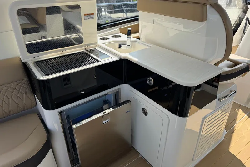 Slide: The Image of Luxury outdoor kitchen on 2022 Sea Ray Sundancer 370 Outboard yacht with grill and fridge. - 27