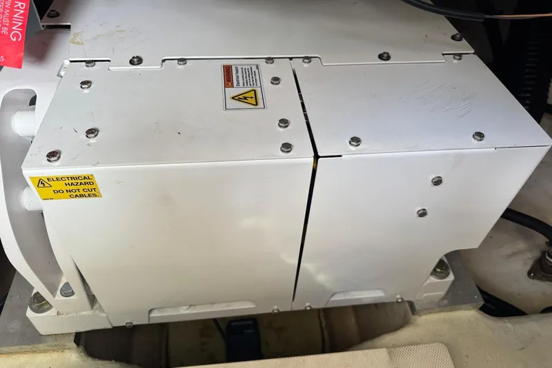 Slide: The Image of Electrical component in 2022 Sea Ray Sundancer 370 Outboard with safety warning labels. - 30