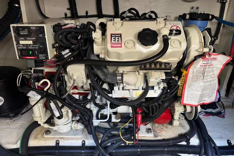 Slide: The Image of Engine compartment of a 2022 Sea Ray Sundancer 370 Outboard, featuring a Westerbeke EFI engine. - 31