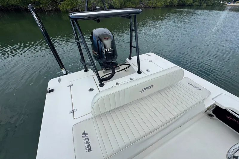 Slide: The Image of 2018 Hewes Redfisher 18 boat with Yamaha 115 engine on calm water. - 10