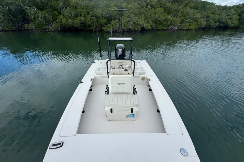 Slide: The Image of 2018 Hewes Redfisher 18 boat on calm water near lush mangroves. - 8
