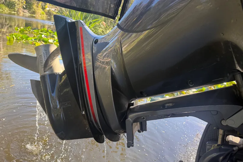 Slide: The Image of 2024 Bennington L Line boat motor in water, showcasing sleek design and performance. - 18