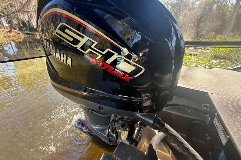 Slide: The Image of Yamaha VMAX outboard motor on 2024 Bennington L Line boat in scenic waterway. - 32