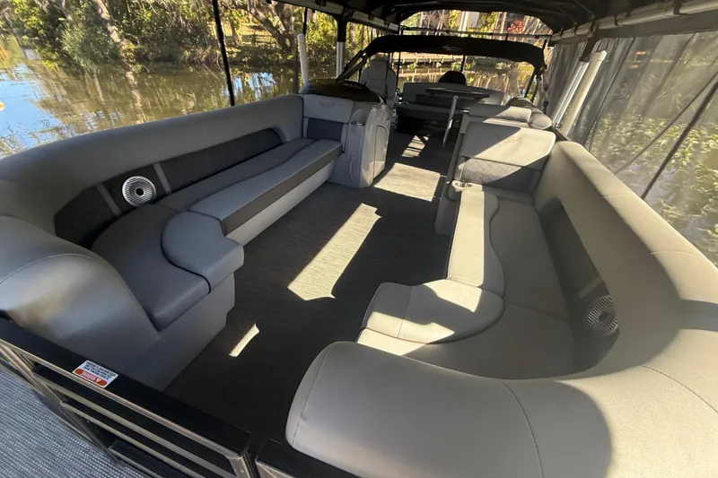 Slide: The Image of 2024 Bennington L Line pontoon boat interior with spacious seating and modern design. - 7