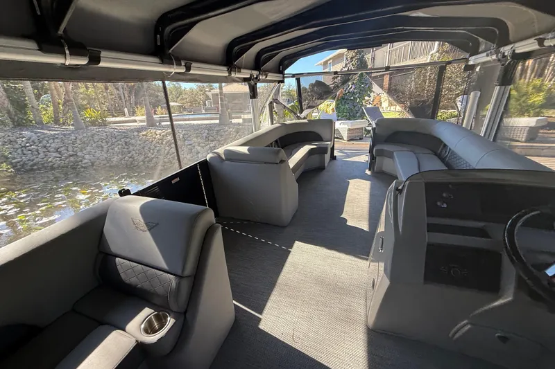 Slide: The Image of 2024 Bennington L Line boat interior with luxurious seating and modern design. - 8