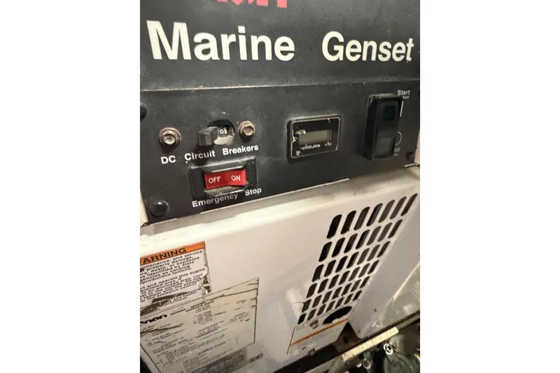 Slide: The Image of Control panel of a marine generator on a 1985 Bertram 54 Convertible boat. - 26