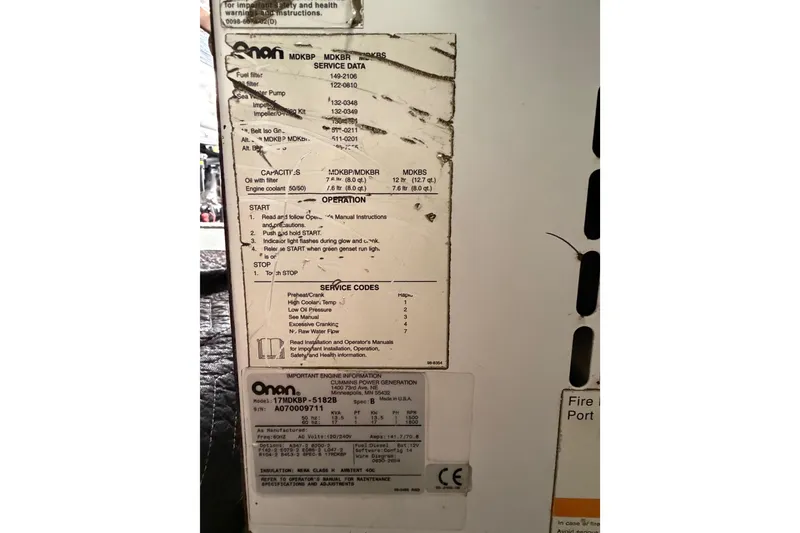 Slide: The Image of Onan generator service data label on a 1985 Bertram 54 Convertible boat. - 27