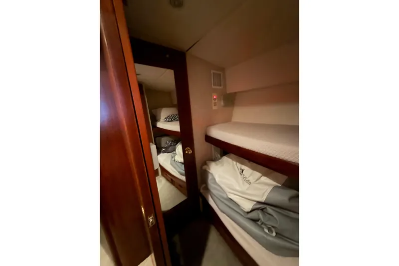 Slide: The Image of Interior of 1985 Bertram 54 Convertible yacht with cozy bunk beds. - 33
