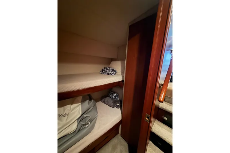 Slide: The Image of Cozy bunk beds in 1985 Bertram 54 Convertible yacht cabin. - 34