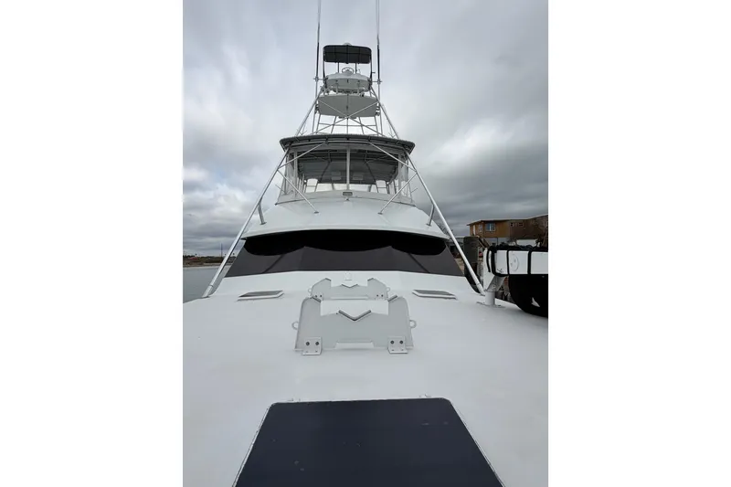 Slide: The Image of 1985 Bertram 54 Convertible yacht with overcast sky background. - 4