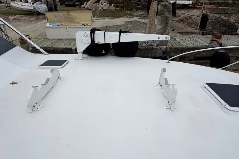 Slide: The Image of 1985 Bertram 54 Convertible yacht deck with davit and hatch covers. - 7