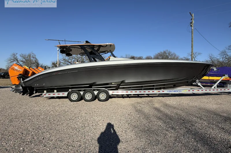 The Image of 2020 Midnight Express 43 Open boat on trailer, featuring powerful engines and sleek design. - 0