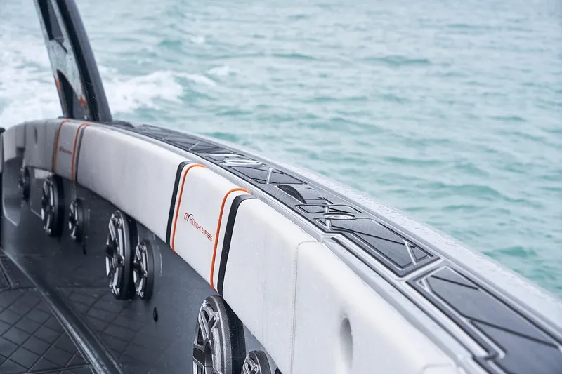 Slide: The Image of 2020 Midnight Express 43 Open boat interior with speakers, on calm water. - 109