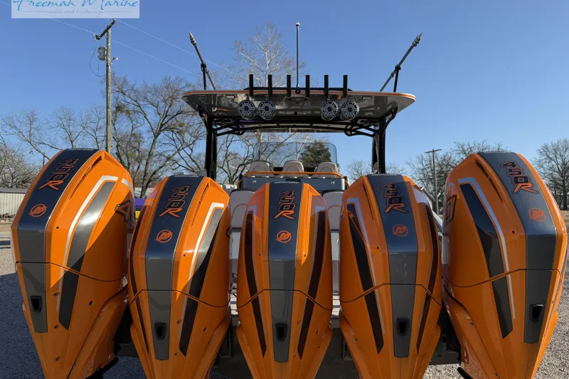 Slide: The Image of 2020 Midnight Express 43 Open with four orange 450R outboard engines. - 11