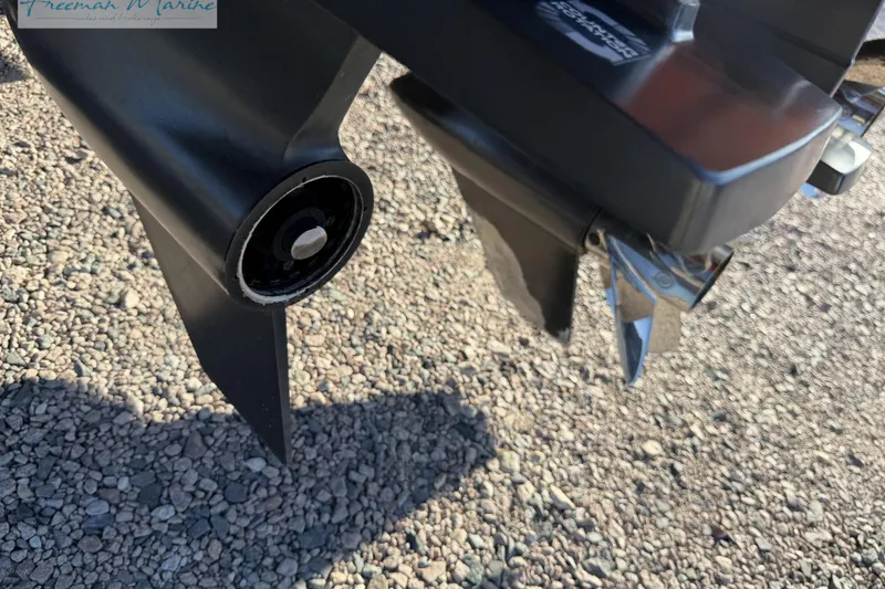 Slide: The Image of Close-up of a 2020 Midnight Express 43 Open boat propeller on gravel. - 17