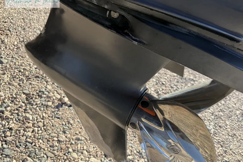Slide: The Image of Close-up of a 2020 Midnight Express 43 Open boat propeller on gravel. - 18