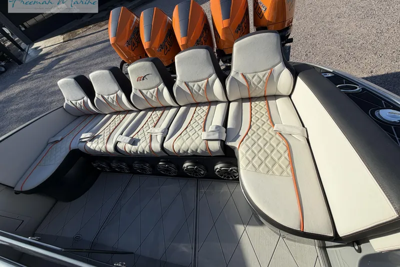 Slide: The Image of Luxurious seating on 2020 Midnight Express 43 Open boat with orange-accented upholstery. - 26