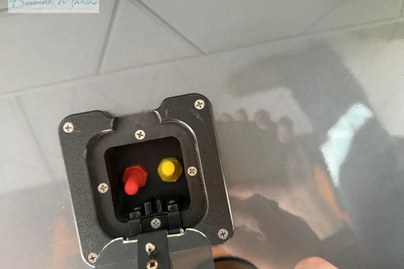 Slide: The Image of Close-up of a 2020 Midnight Express 43 Open boat's electrical panel with red and yellow switches. - 29