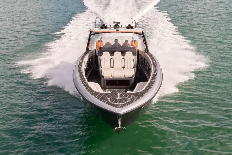 Slide: The Image of 2020 Midnight Express 43 Open boat cruising on clear blue water. - 3