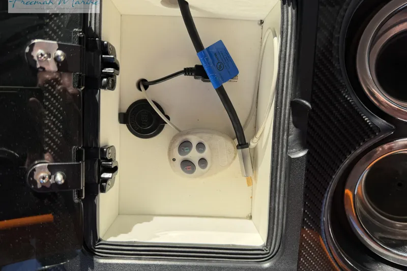Slide: The Image of Storage compartment in a 2020 Midnight Express 43 Open boat with electronic controls and wiring. - 30