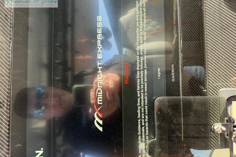 Slide: The Image of Display screen of a 2020 Midnight Express 43 Open boat with Garmin interface. - 31