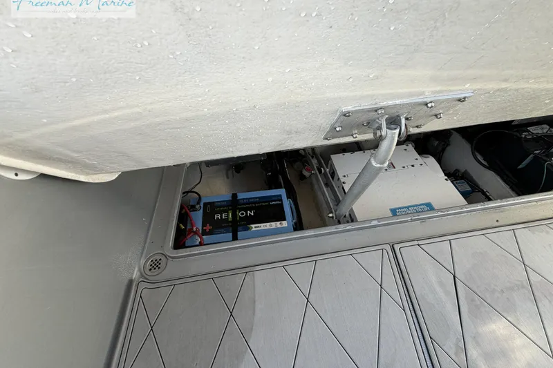 Slide: The Image of Battery compartment of a 2020 Midnight Express 43 Open boat, featuring a Relion lithium battery. - 34