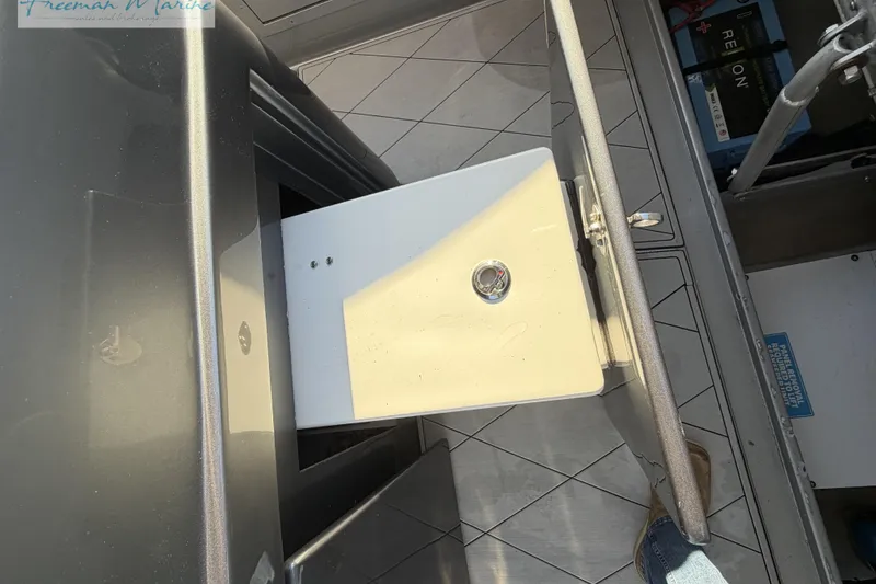 Slide: The Image of Open storage compartment on a 2020 Midnight Express 43 Open boat deck. - 37