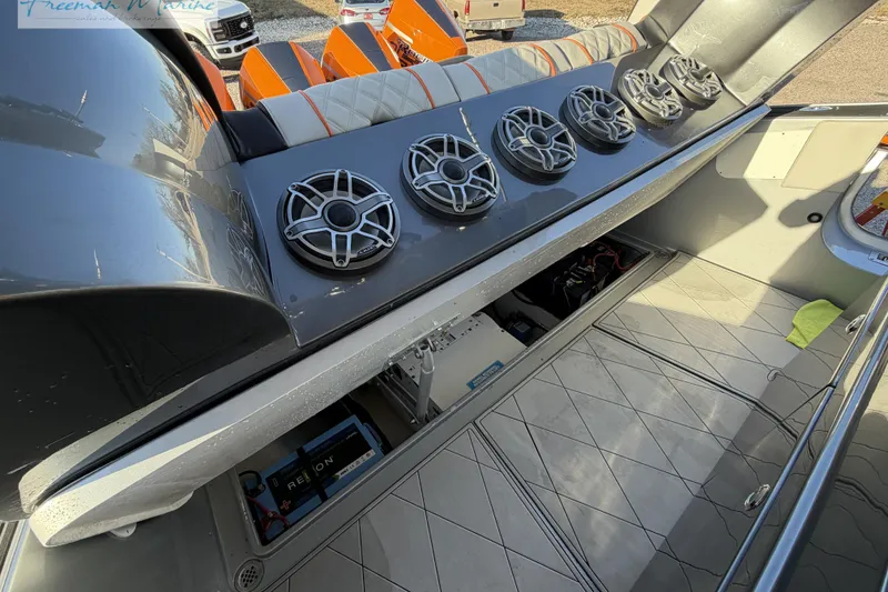 Slide: The Image of 2020 Midnight Express 43 Open boat interior with speakers and storage compartments. - 42