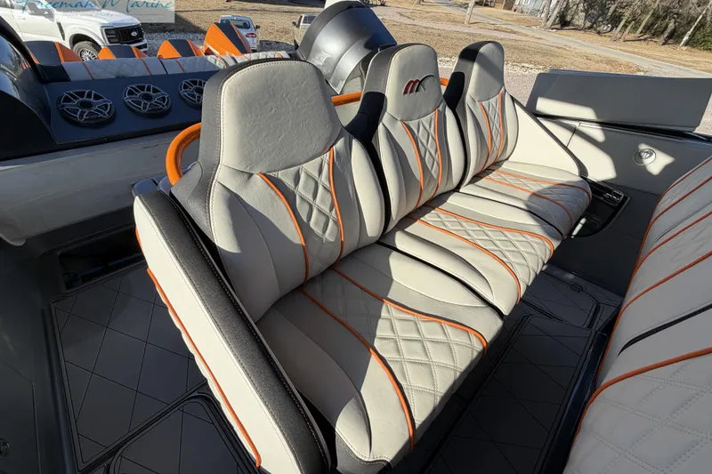 Slide: The Image of Luxurious seating in 2020 Midnight Express 43 Open boat with stylish orange accents. - 46