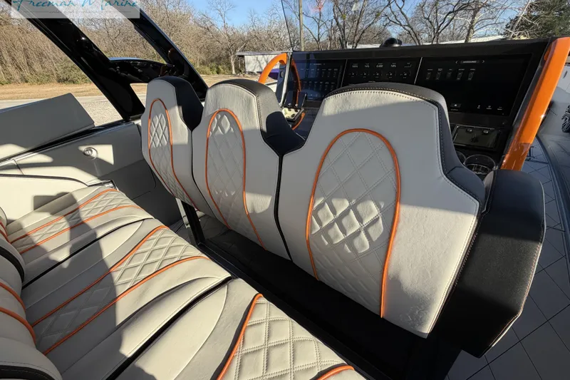 Slide: The Image of 2020 Midnight Express 43 Open boat interior with stylish quilted seats and orange accents. - 48