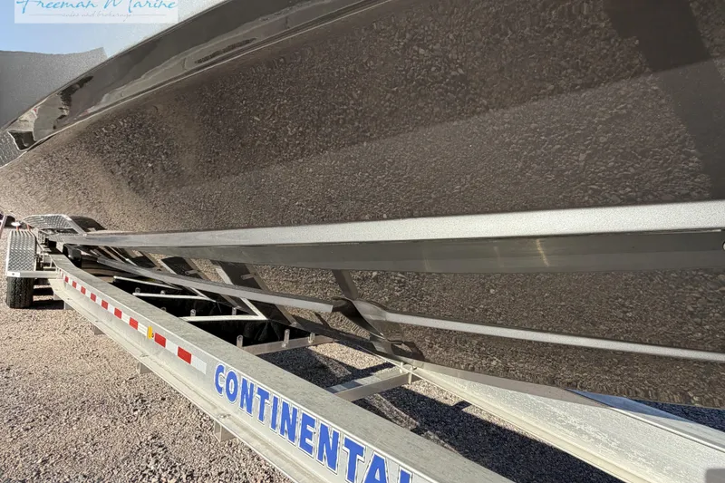 Slide: The Image of 2020 Midnight Express 43 Open boat on Continental trailer, side view. - 5