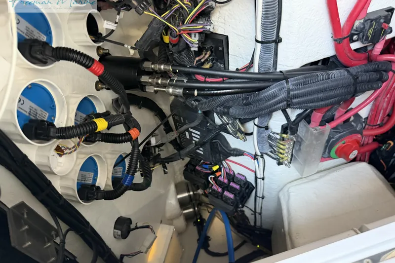 Slide: The Image of Electrical wiring and components inside a 2020 Midnight Express 43 Open boat. - 57