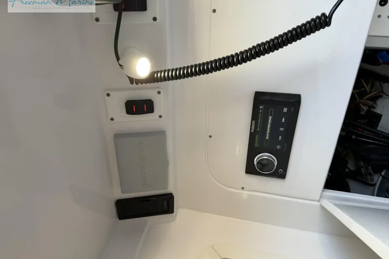 Slide: The Image of Control panel of a 2020 Midnight Express 43 Open boat with light and audio system. - 59