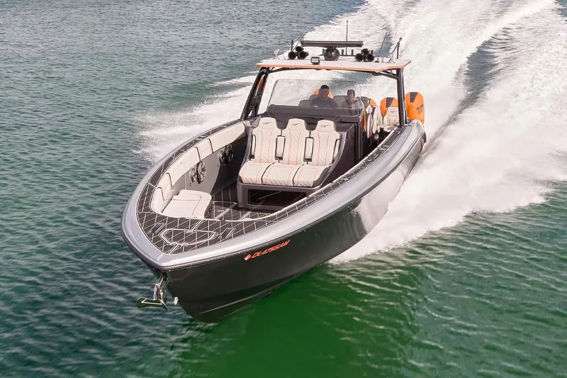 Slide: The Image of 2020 Midnight Express 43 Open boat cruising on water, showcasing sleek design and powerful performance. - 75
