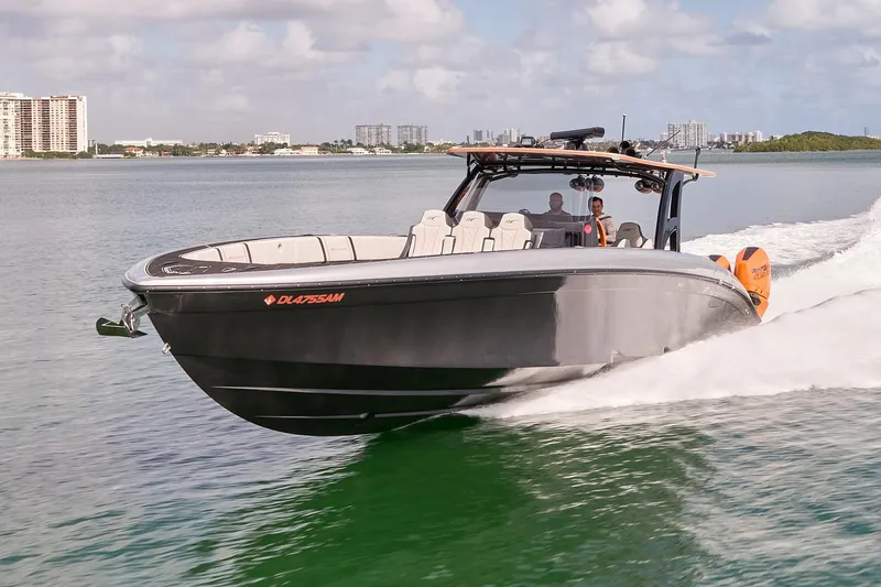 Slide: The Image of 2020 Midnight Express 43 Open boat cruising on water, showcasing sleek design and powerful performance. - 76