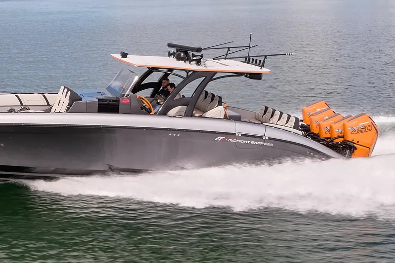 Slide: The Image of 2020 Midnight Express 43 Open boat cruising with powerful outboard engines. - 78