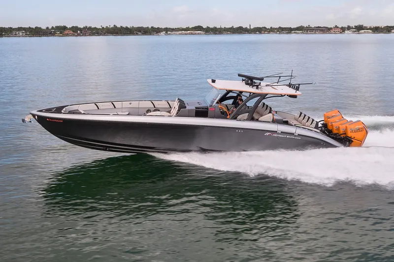 Slide: The Image of 2020 Midnight Express 43 Open boat cruising on calm water with powerful engines. - 79