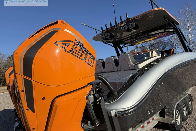 Slide: The Image of 2020 Midnight Express 43 Open boat with orange Mercury Racing 450R engines. - 8
