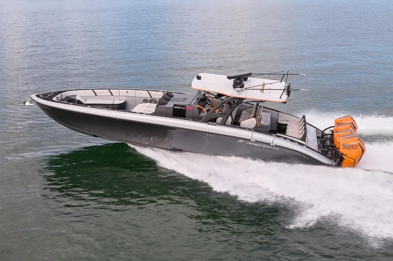 Slide: The Image of 2020 Midnight Express 43 Open boat cruising on water with powerful engines. - 80