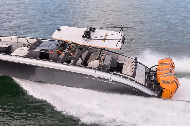 Slide: The Image of 2020 Midnight Express 43 Open boat speeding on water with powerful engines. - 81