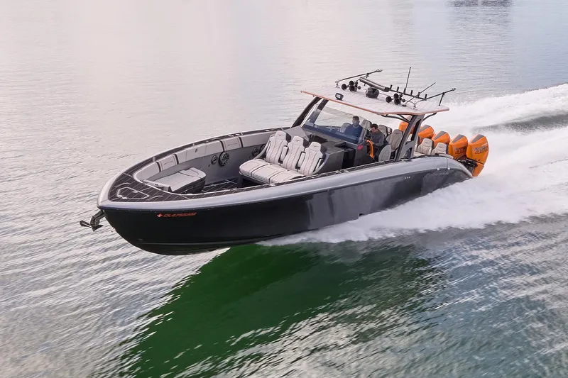 Slide: The Image of 2020 Midnight Express 43 Open boat speeding on water with multiple outboard engines. - 83