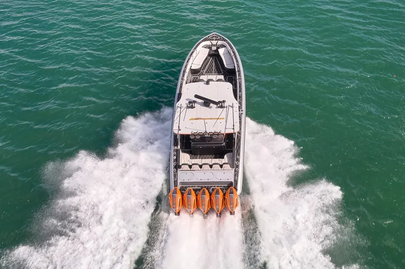 Slide: The Image of 2020 Midnight Express 43 Open boat cruising on clear blue water. - 87