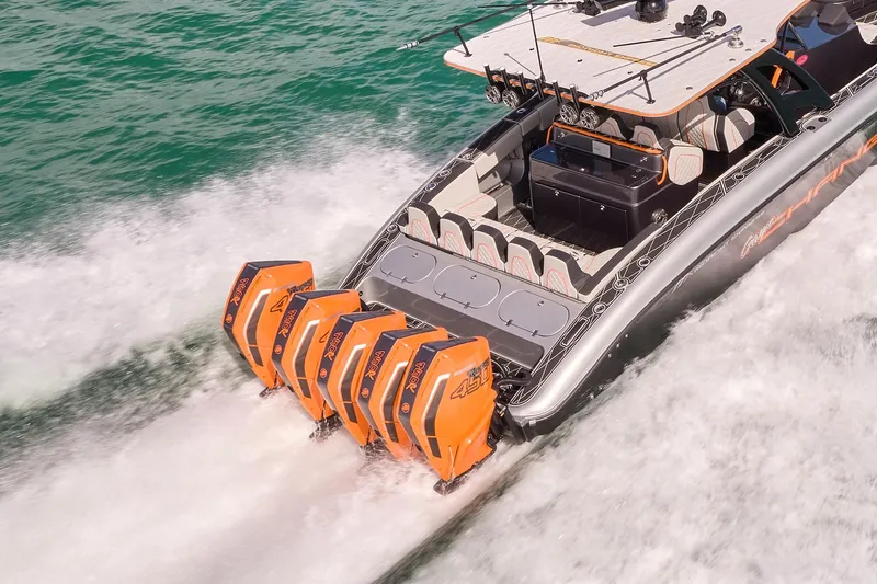 Slide: The Image of 2020 Midnight Express 43 Open boat with five powerful outboard engines on the water. - 89