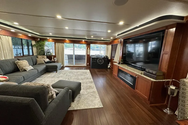 Slide: The Image of Luxurious 2022 Trifecta houseboat interior with modern living area, large TV, and elegant decor. - 14